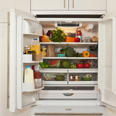 View inside refrigerator packed with healthy foods.