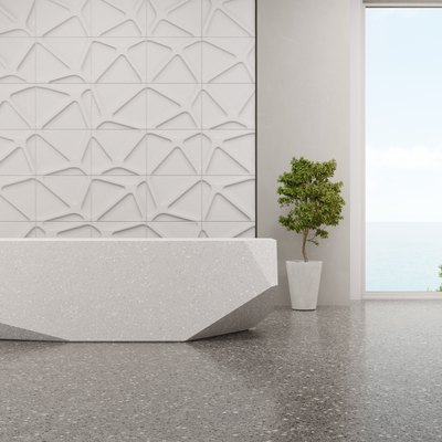 Luxury interior design of modern showroom with terrazzo floor and empty white tile wall background.