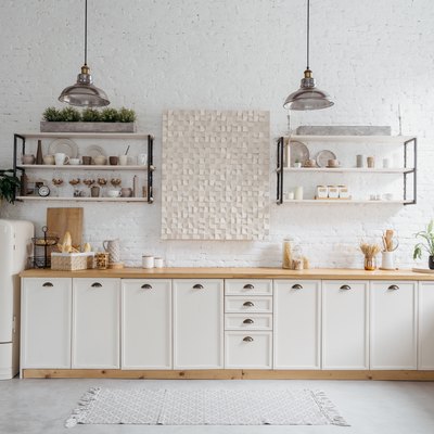 Rustic kitchen interior with white brick wall.