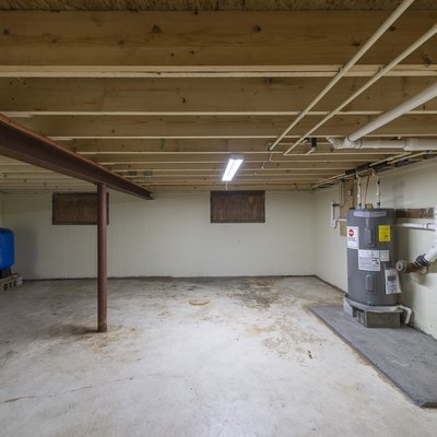 Basement with appliances in a residential house, empty, clean, and ready for sale.