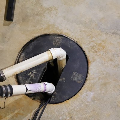 A sump pump in a home basement.