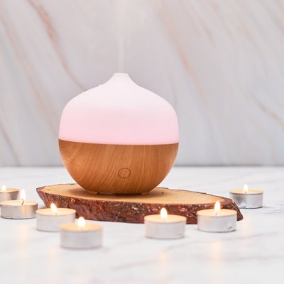 Aroma oil diffuser on table at home. Aromatherapy spa Concept