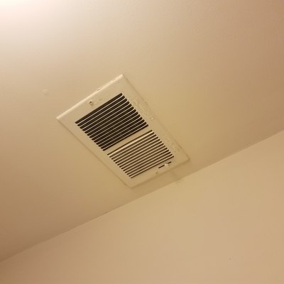 vent on the ceiling and white wall
