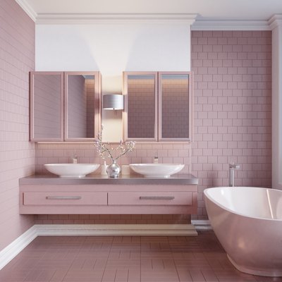 Modern-style home interior bathroom is tiled with pink tiles.