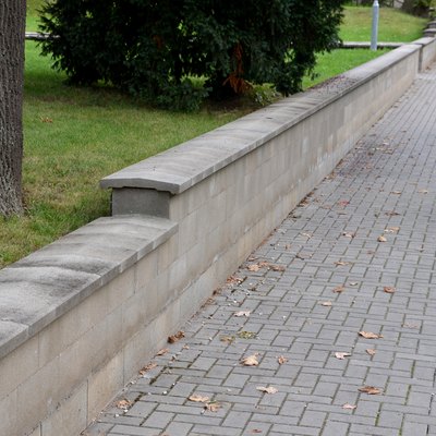 Concrete retaining wall blocks, low dividing wall of yard.
