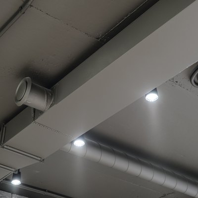 Ceiling ventilation ducts and LED lights. Engineering air system.