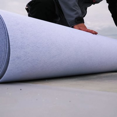 Rolls of polymer coating for roof. Deployment of a roof covering roll.