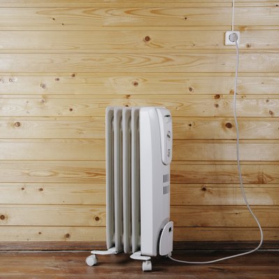 Heater against a wooden wall. Space for text or design