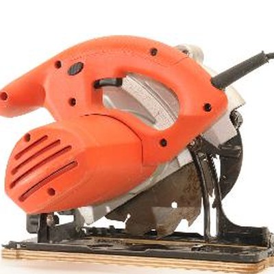 red circular saw on white background