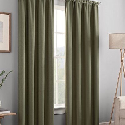 Machine-washable, lined blackout thermal rod pocket curtain panels in living room.