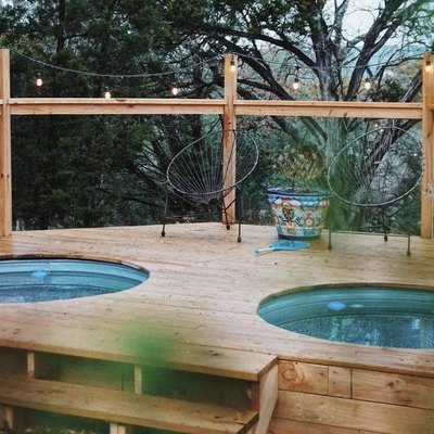 two above ground stock tank pools with deck