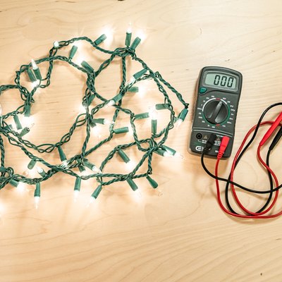 holiday lights illuminated with multimeter electrical tester