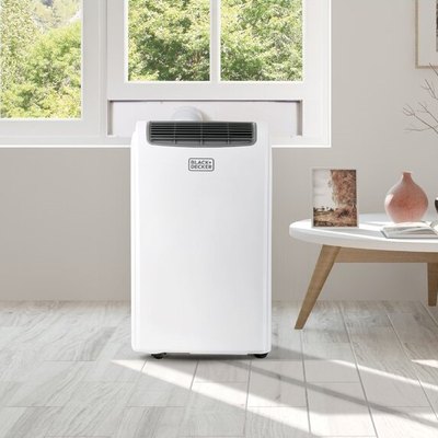 White portable air conditioner in white and gray living room