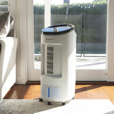 A white portable evaporative cooler in a living room