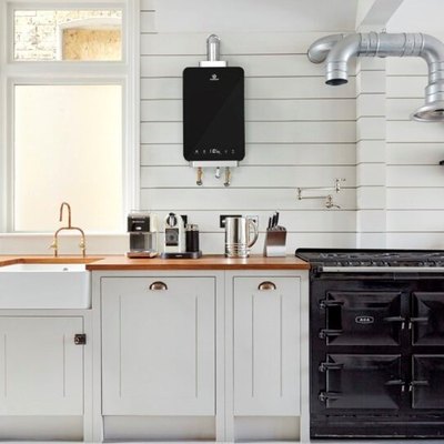 Black LP Tankless Water Heater on Wall in Modern White Kitchen
