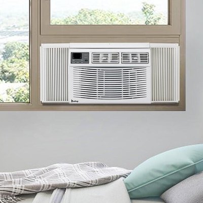 White window air conditioner in gray bedroom