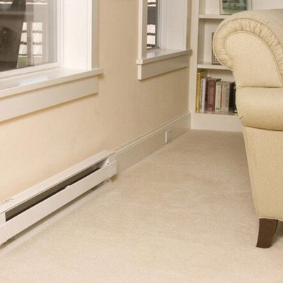 Electric convection baseboard heater in living room or study