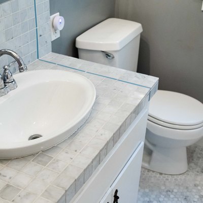 tile bathroom countertop in white and gray bathroom