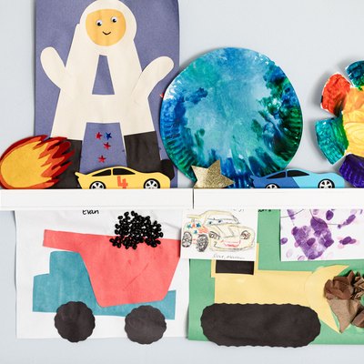kids drawings on a shelf