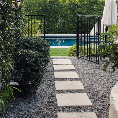 slate walkway on gravel to pool area