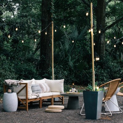 Succulent planter-wood pole string lights with patio furniture