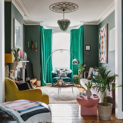 historic home with boho eclectic decor with green walls and rapes