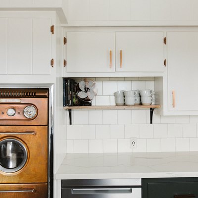 White kitchen with midcentury copper oven