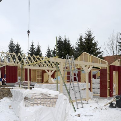 wooden house construction at winter time