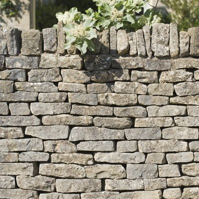 Stone wall covering house