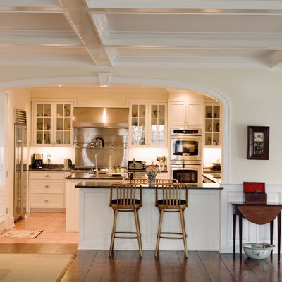 Kitchen with bar stools at counter
