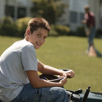 Boy on lawn mower