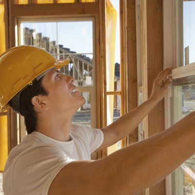 Construction Worker Building a House