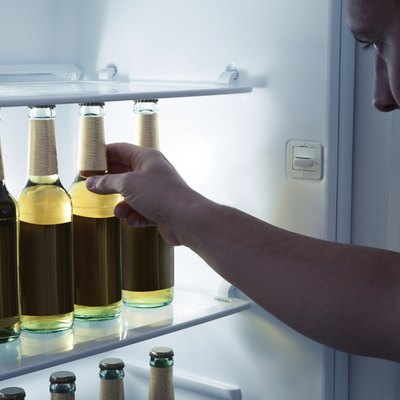 Man taking beer from a fridge