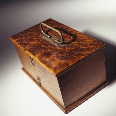 Polished antique wooden oak box with brass handle