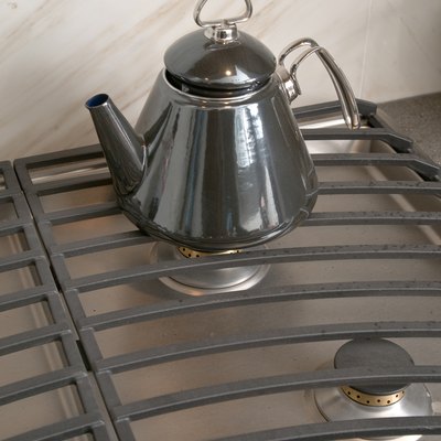 Tea kettle on contemporary gas stove