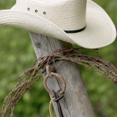 Cowboy hat and lasso on post