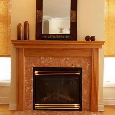 Fireplace with decorative vases and mirror