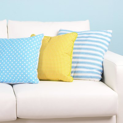 White sofa close-up in room on blue background