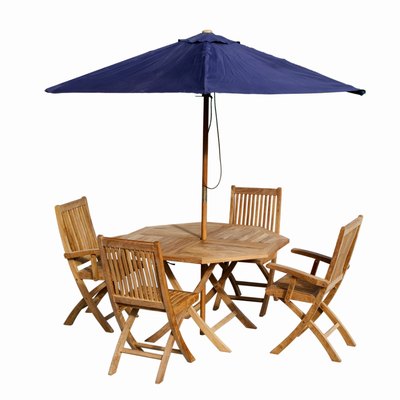 Close up of a garden table and chairs and an umbrella
