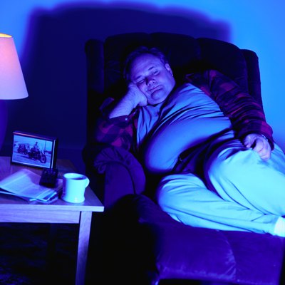 Man in a Recliner Chair Watching Television