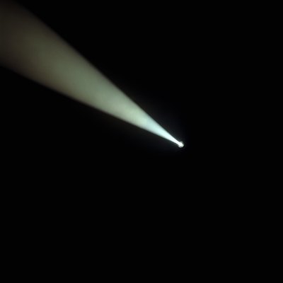 Beam of spotlight in darkness