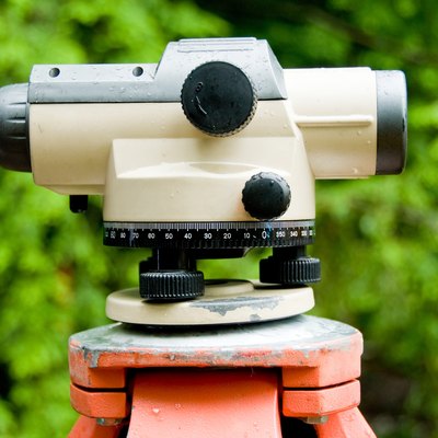 Close-up of theodolite atop tripod