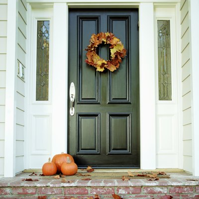 Pumpkins on front step of house