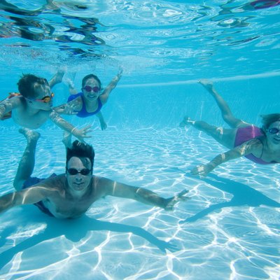 Family swimming underwater