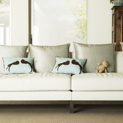 Stuffed Bear and pillows on sofa
