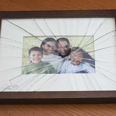 Shattered glass on family portrait