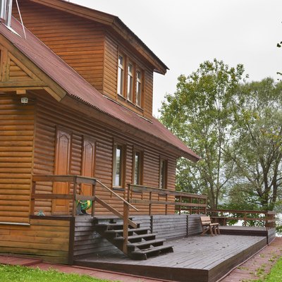 country wooden house close to lake