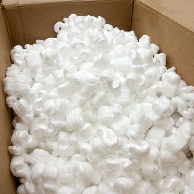 Open cardboard box with packing peanuts