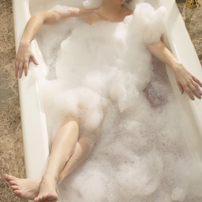Woman relaxing in bathtub