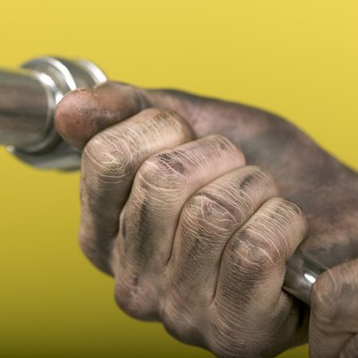 Hand holding socket wrench